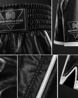 Close up of high-quality black satin fabric and reinforced white piping on custom boxing trunks.