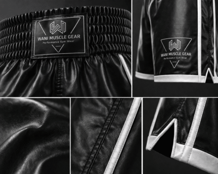 Close up of high-quality black satin fabric and reinforced white piping on custom boxing trunks.