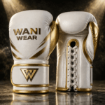 Royal white and gold competition boxing gloves by WANI WEAR made from premium cowhide leather with ergonomic grip, multi-layer foam padding, and luxury gold detailing.