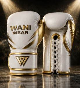 Royal white and gold competition boxing gloves by WANI WEAR made from premium cowhide leather with ergonomic grip, multi-layer foam padding, and luxury gold detailing.