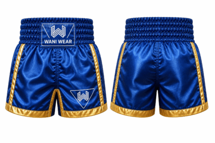 Premium blue boxing shorts front and back view with gold trim, satin fabric, elastic waistband, side vents, reinforced stitching, and Wani Wear logo on white background.