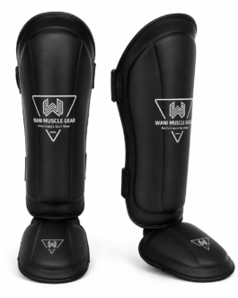 Black premium shin and instep guards with high-density foam, PU leather, and secure hook-and-loop straps by Wani Muscle Gear for boxing, MMA, kickboxing, and Muay Thai.