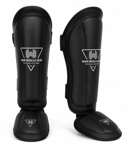 Black premium shin and instep guards with high-density foam, PU leather, and secure hook-and-loop straps by Wani Muscle Gear for boxing, MMA, kickboxing, and Muay Thai.