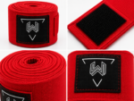Close-up of custom boxing hand wraps showing premium rubber logo patch, reinforced stitching, hook and loop closure, and high-quality cotton fabric for professional boxing equipment.
