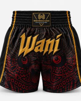 : Black and red satin Muay Thai boxing shorts with gold Wani logo, front view