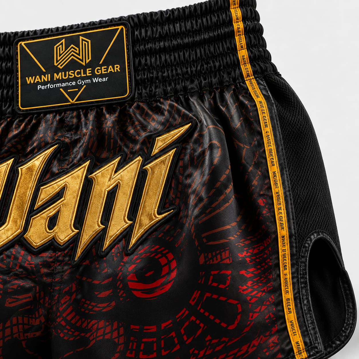 Wani Dragon Muay Thai Shorts – Black & Gold Custom Wani Muscle Gear boxing shorts waistband with gold embroidered logo and mesh side panel