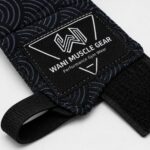 Close-up of Wani Muscle Gear custom logo patch and hook and loop closure on wholesale boxing hand wraps