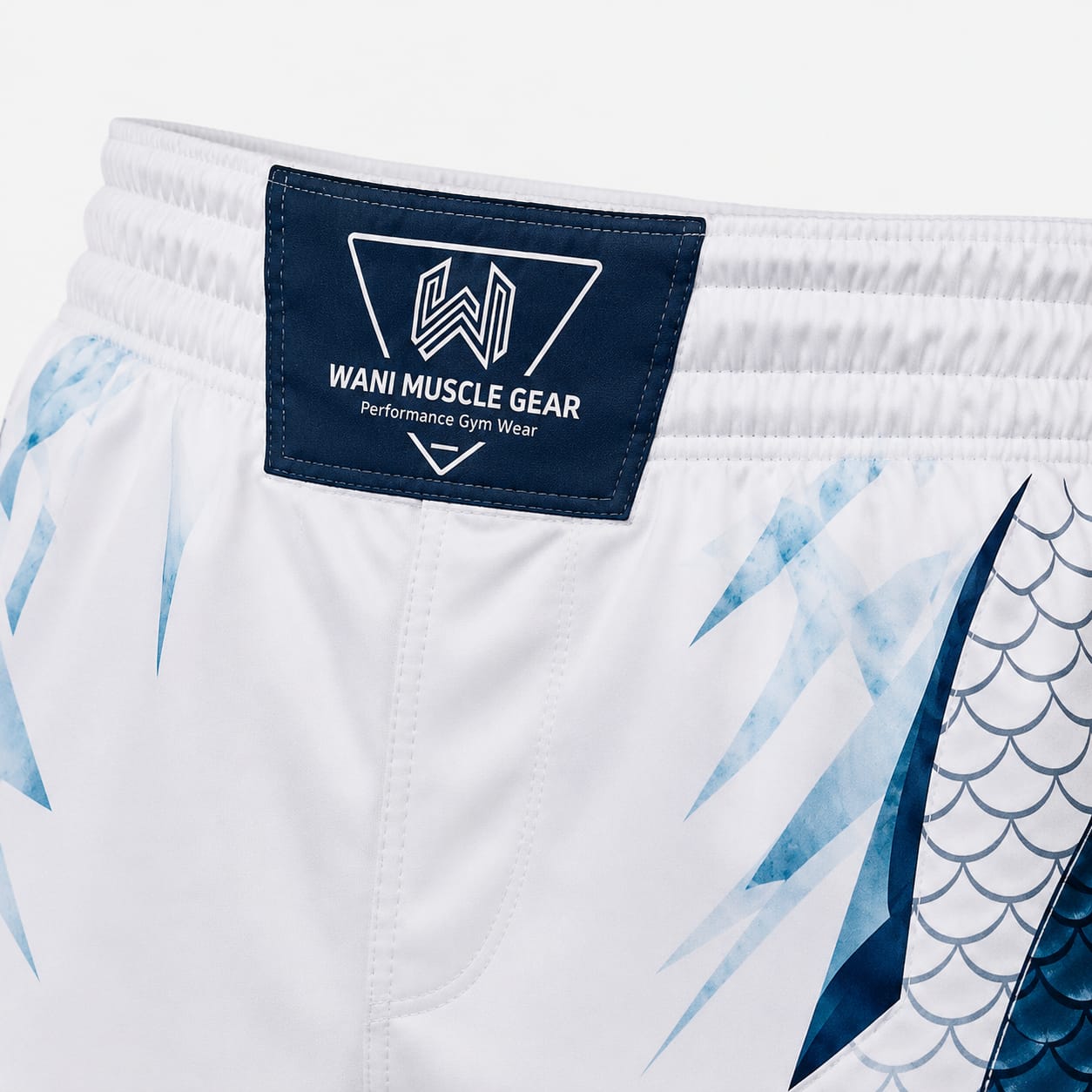 Arctic Dragon Custom MMA Fight Shorts Wani Muscle Gear waistband label close-up on custom boxing shorts