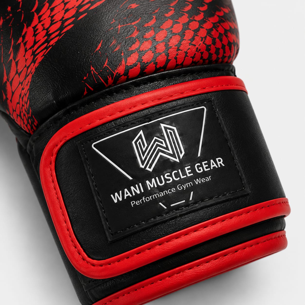 Wani Wear PU Leather Boxing Gloves – Dragon Scale Training & Sparring Gloves Close-up of Wani Muscle Gear boxing glove wrist strap and logo patch