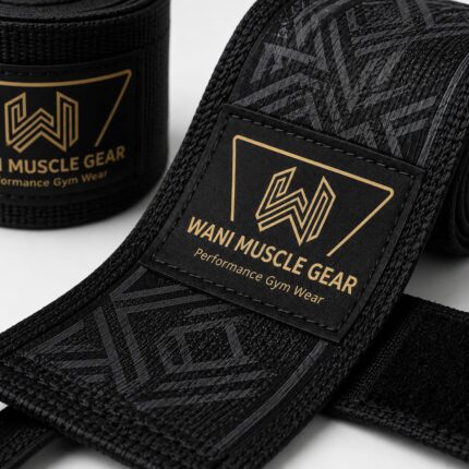 Wani Muscle Gear Black Hand Wrap Close-Up – Gold Logo Patch and Geometric Weave