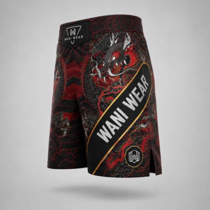 Home Side angled view of custom black and red dragon MMA fight shorts with Wani Wear branded waistband and side slit