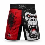 Custom sublimated MMA fight shorts front view with wide elastic waistband, reinforced stitching, and side slit mobility panels by Wani Wear