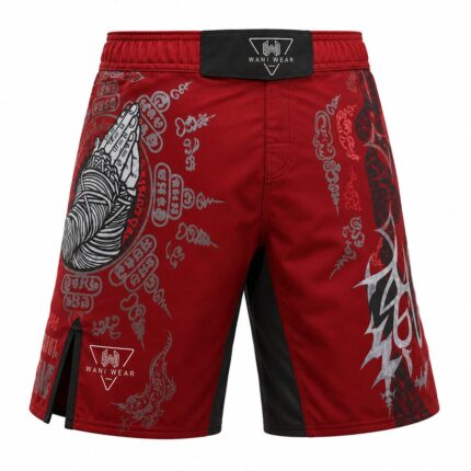 Home Sak Yant praying hands MMA fight shorts, angled side view, red sublimated fabric