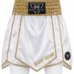 White and gold satin boxing shorts front view with Wani Wear branding and gold trim